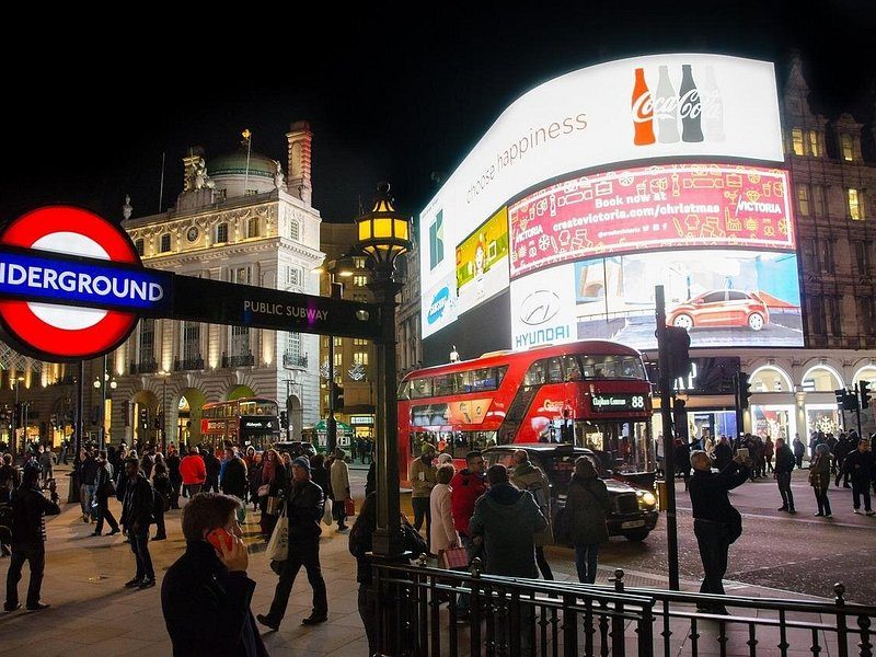 The lit screens of Piccadilly Circus at night