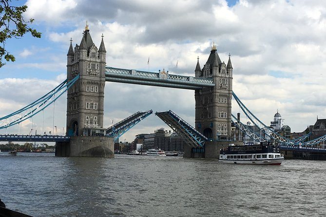 Tower Bridge with its bascules raised over the Thames